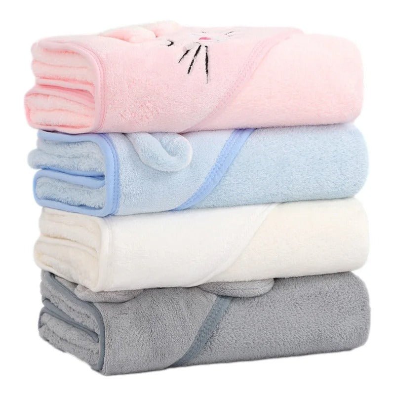 Cape de bain bébé en couleur douce