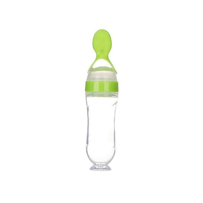 cuillere bebe vert à presser avec la main